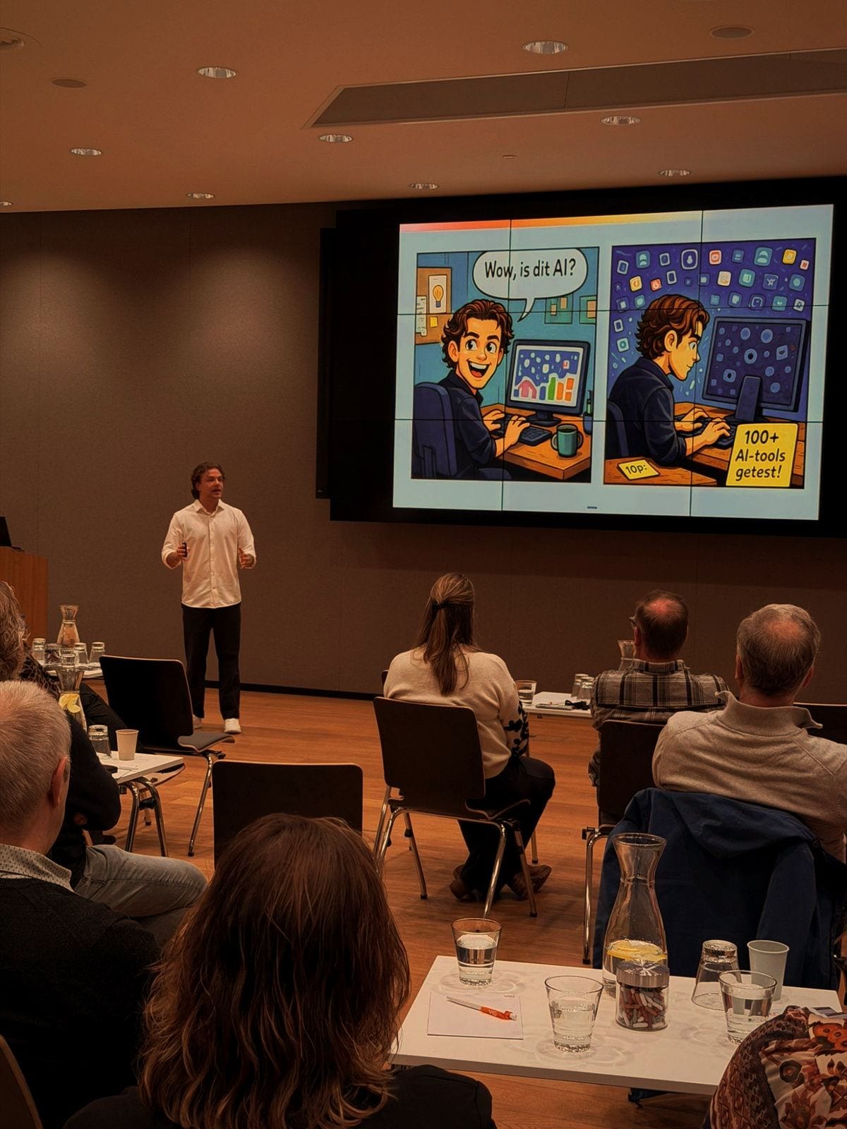 Participants watching a screen with an illustration about a hundred AI tools tested